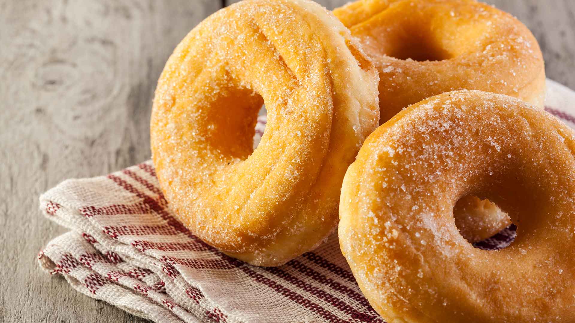 Closeup of sugared donuts.