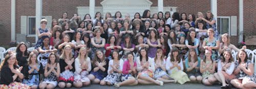 Pi Beta Phi group photo in front of their Greek house.