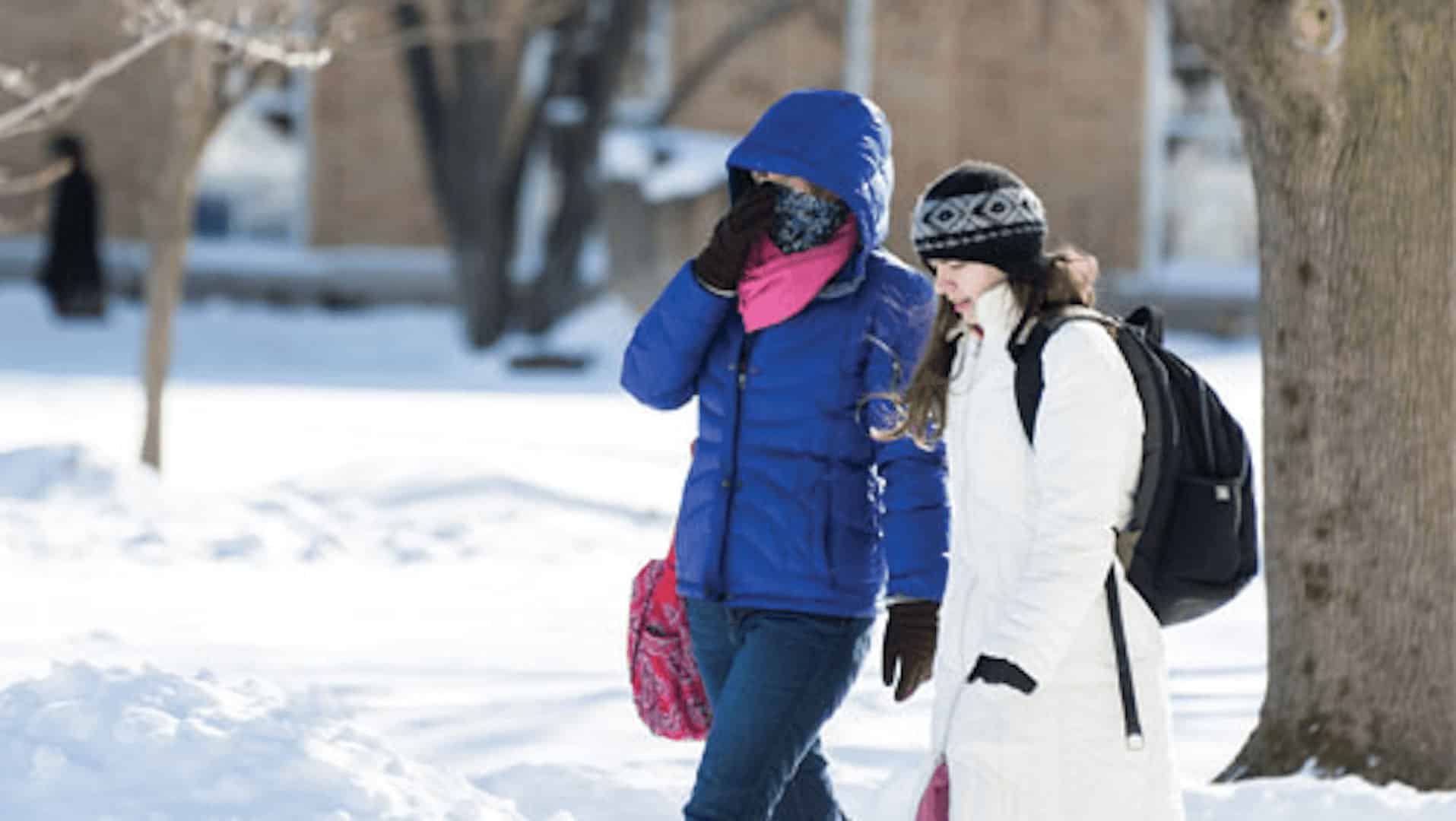 Students walking on campus in snow