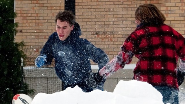 Students playing Thatcherball in the snow.