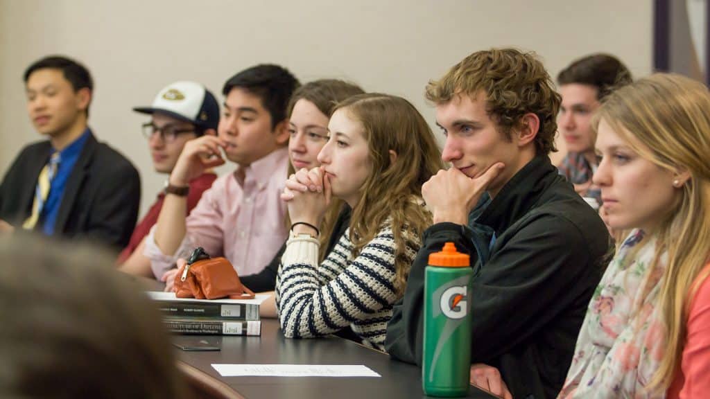 Students listening to an Economics lecture.