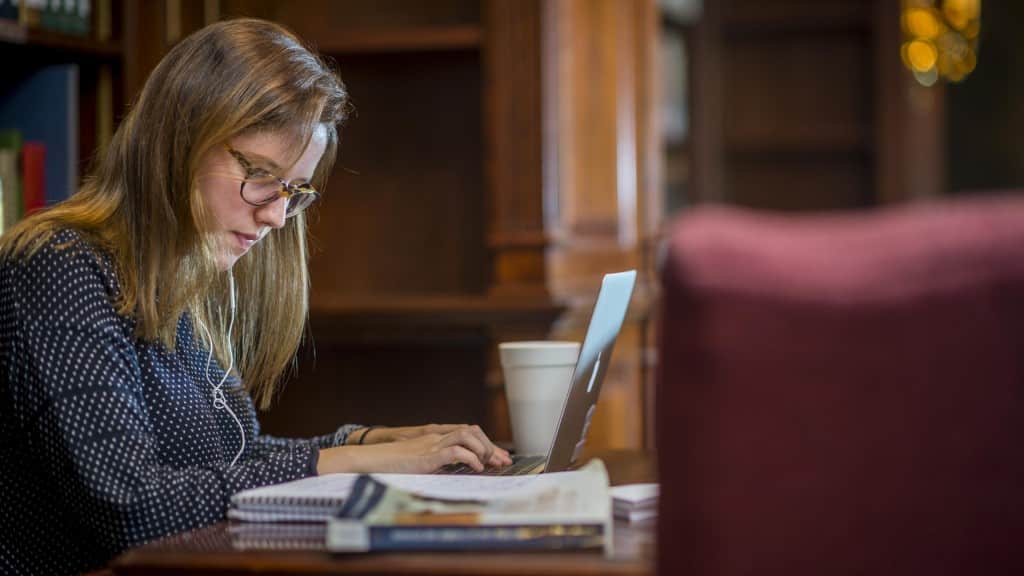Student working from the library.