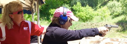 Shooting sports instructor Sheila teaching proper pistol handling.