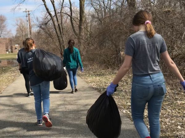 Students picking up trash for community service.