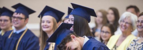 Students laughing at commencement