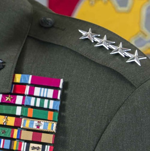 Closeup of a U.S. Marine Lt. Gen. uniform's stars and medals.