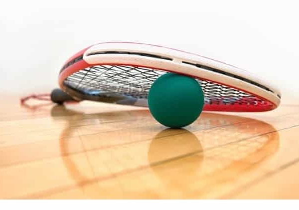 racquetball and racquetball racquet on a racquetball court