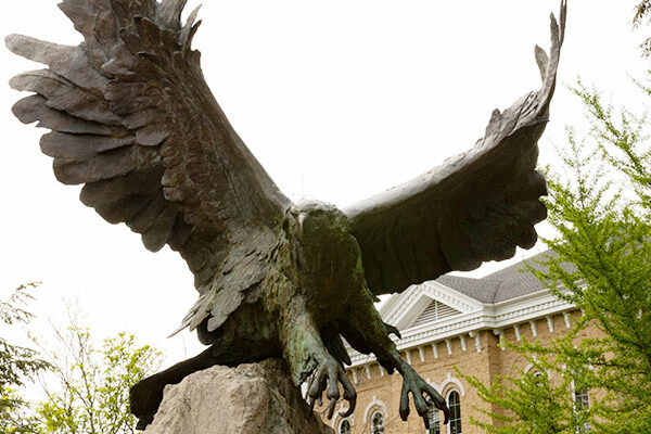 An image of the famous Eagle sculpture that greets visitors at the Hillsdale College campus